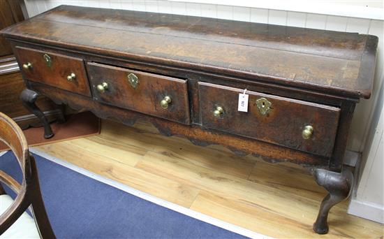 A George III banded oak low dresser, W.188cm D.51cm H.77cm